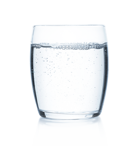 Glass of clear, sparkling water against a white background, representing a drink to prevent dehydration